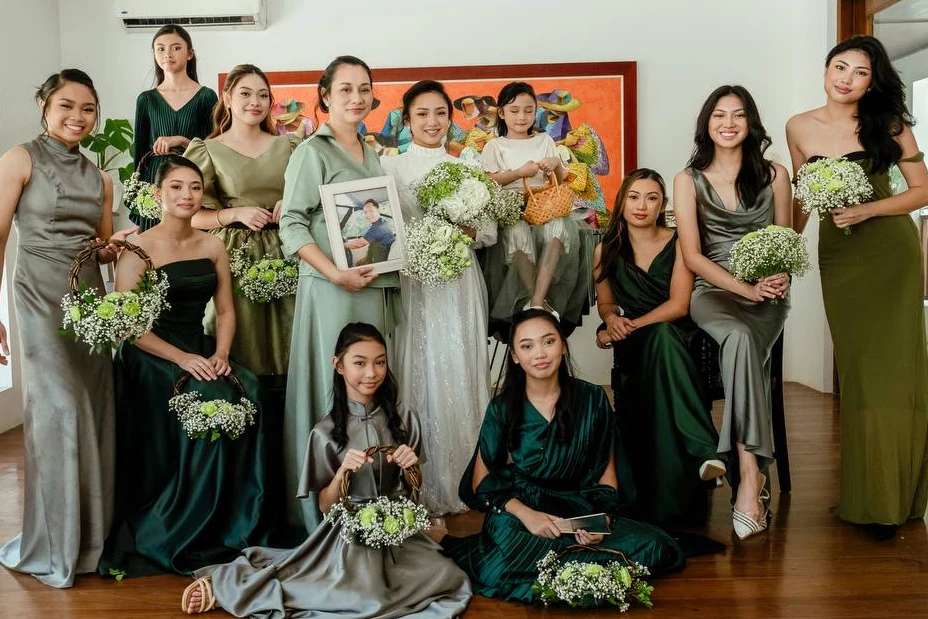 Bride and bridal party in green and silver dresses